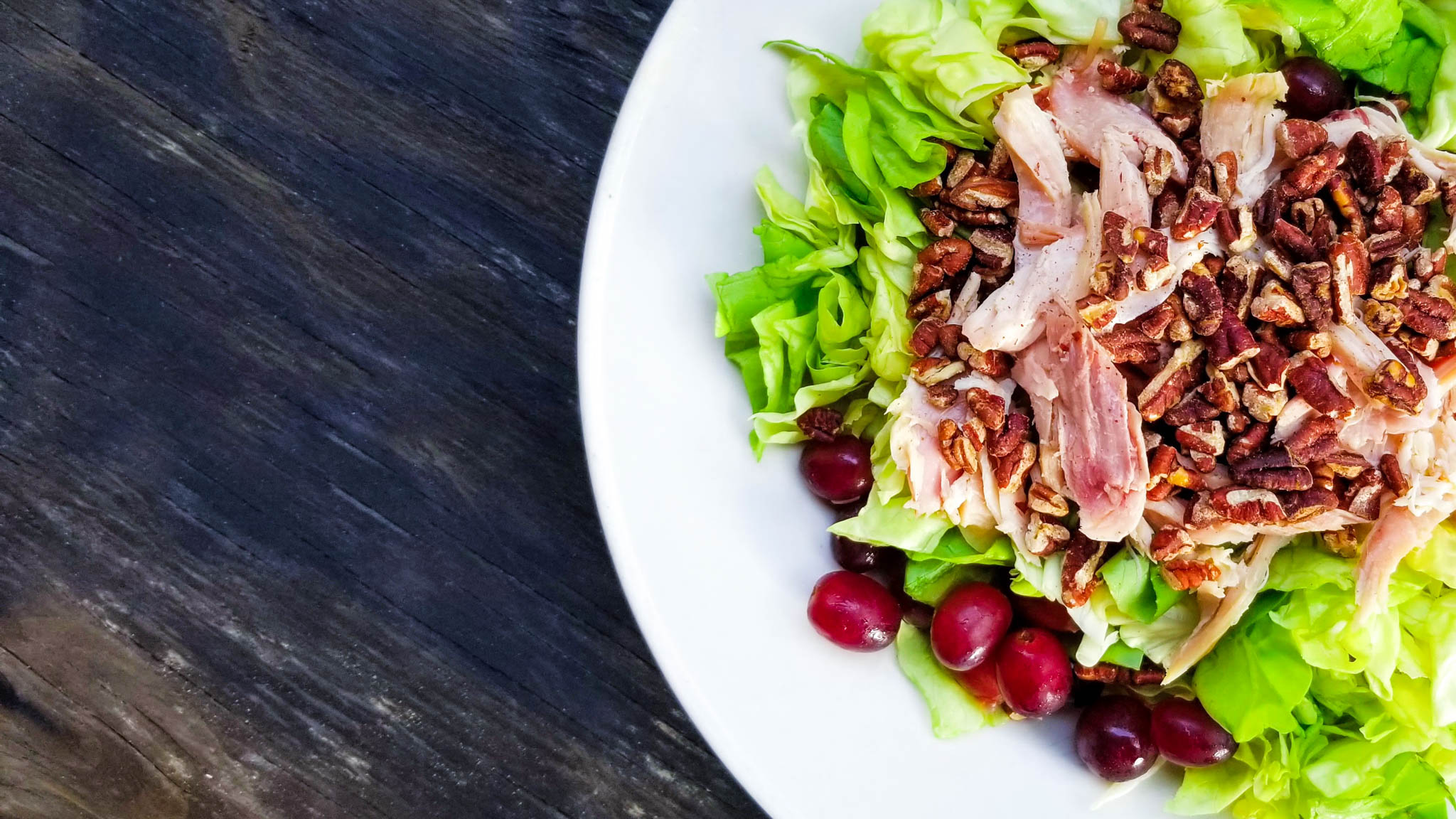 Salad of crisp butter lettuce, smoked chicken, toasted pecans, red seedless grapes.